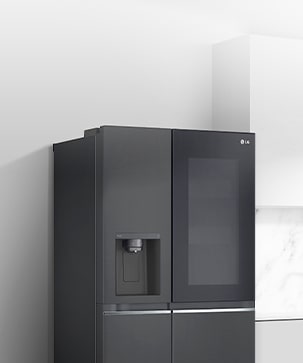 A side view of a kitchen with a black InstaView refrigerator installed.