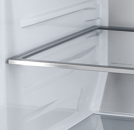 A diagonal view of the shelf with metallic paneling on the interior of the refrigerator.