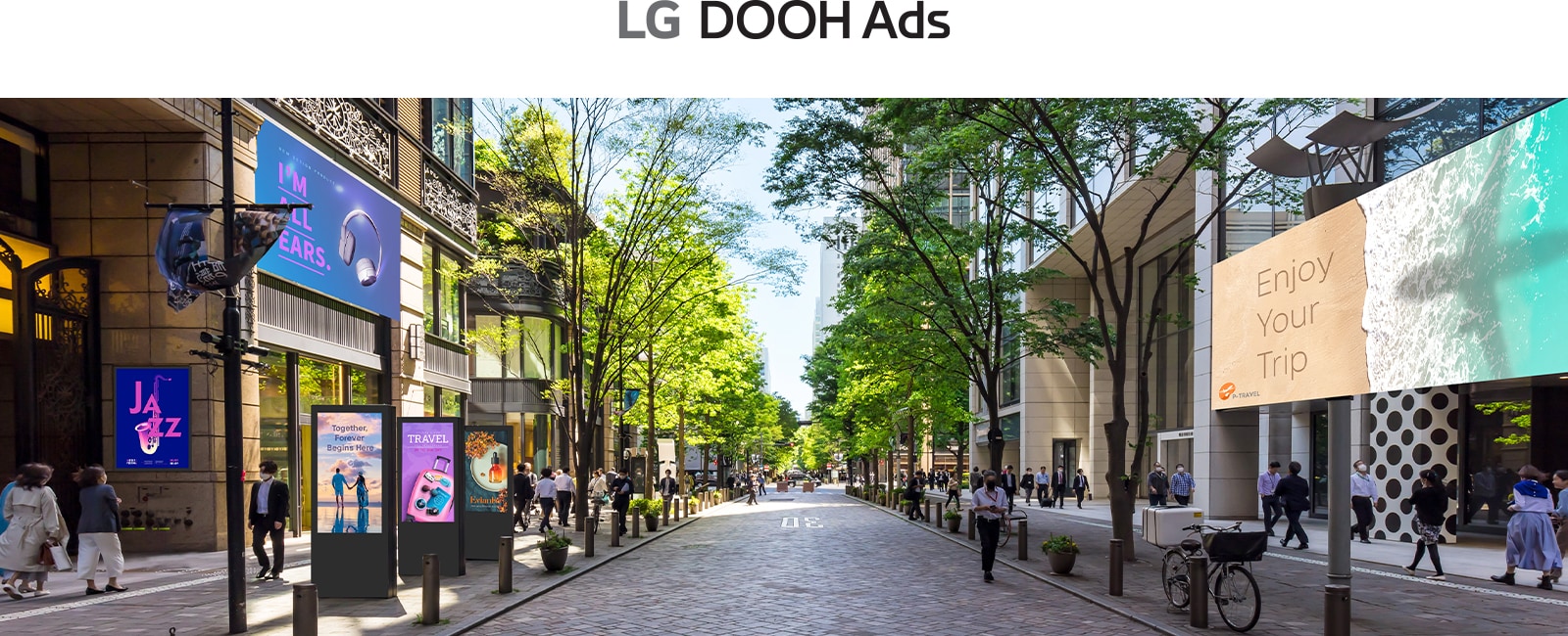 This image highlights digital signage in an outdoor space, displaying a range of ads covering topics like music, travel, and beauty.