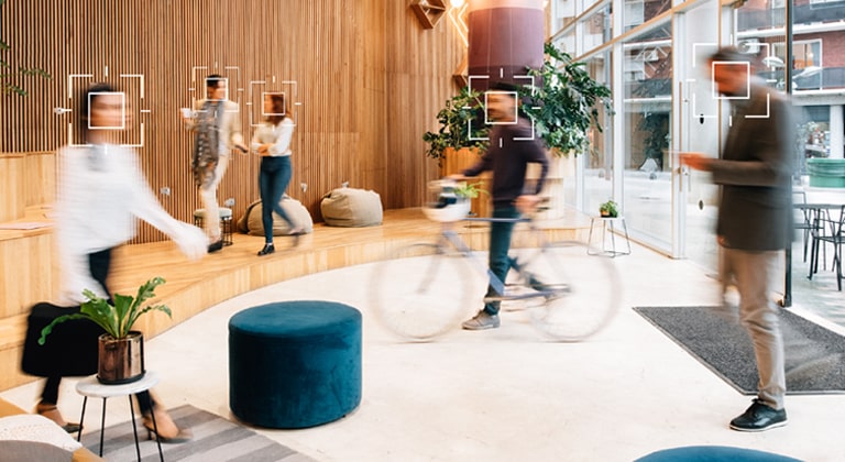 This image shows the view from the digital signage itself, demonstrating how it analyzes foot traffic data of people nearby.