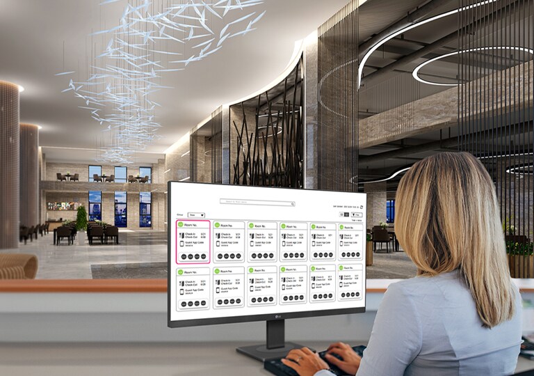 An administrator is monitoring the status of hotel rooms using a PC.