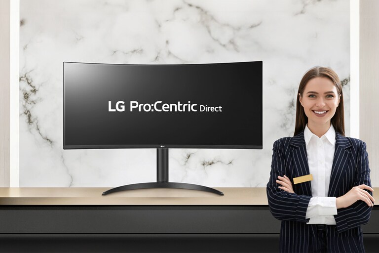 The LG Pro:Centric Direct solution text is visible on the monitor, accompanied by a smiling hotelier.