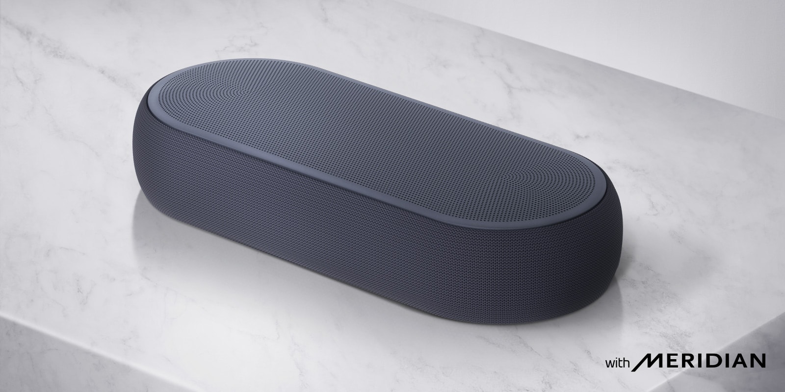 Close-up LG Soundbar right side with LG logo on the bottom right corner of a product.