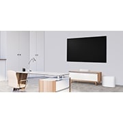 LG QP5W | 3.1.2ch | 320W | Dolby Atmos, A side view of a soundbar and a subwoofer placed in a white office, QP5W, thumbnail 6