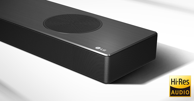 Close-up right side of LG Soundbar with LG logo shown on the bottom right corner. Hi-Res logo is shown below the product. 