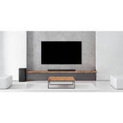 LG SP7 | 5.1ch | 440W | Dolby Digital , A subwoofer, a soundbar, and TV are in a white living room, SP7, thumbnail 4