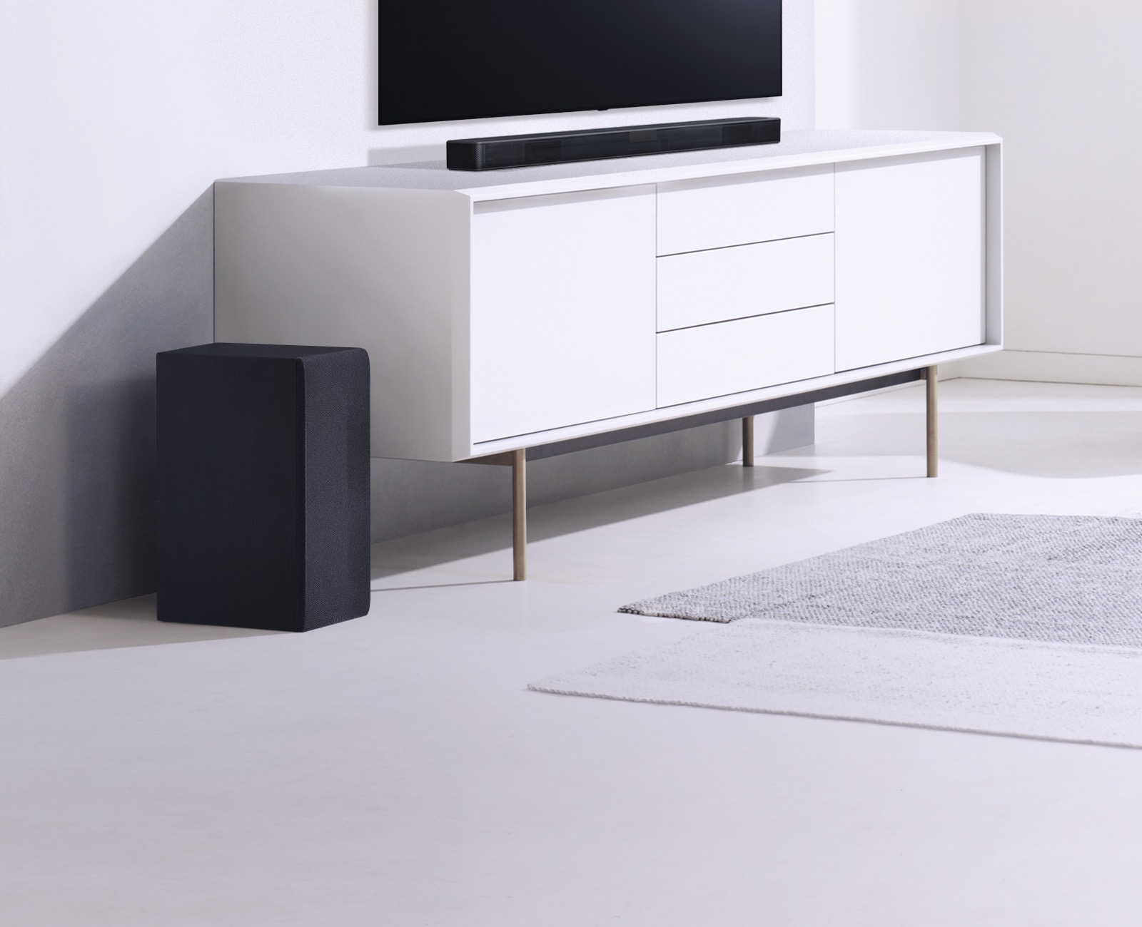 Image of TV, sound bar and subwoofer set up