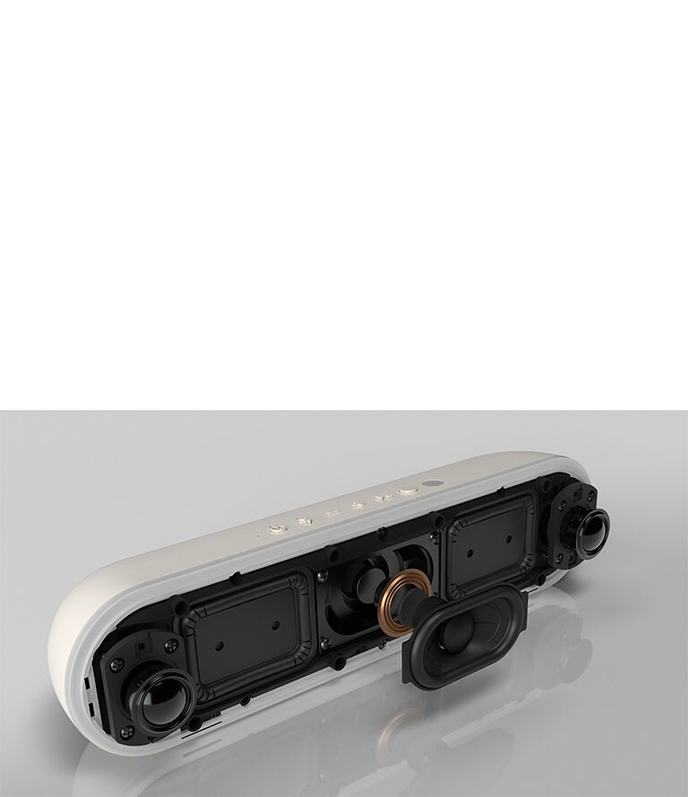 The LG StanbyME speaker XT7S is placed on the reflective surface, showing its dual tweeters.