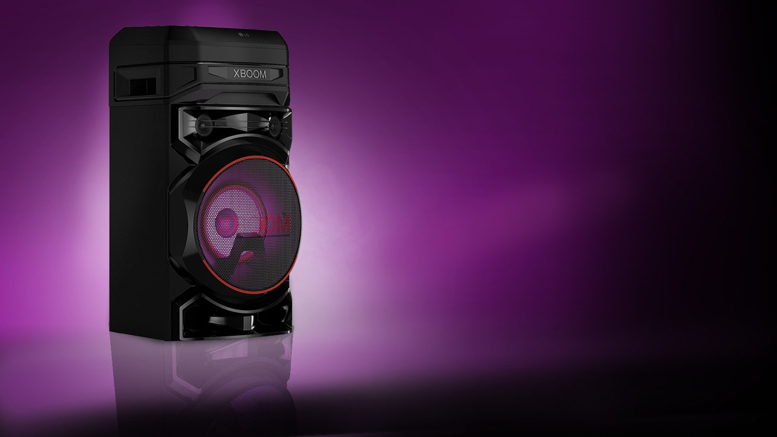 A low angle view of the left side of LG XBOOM against a purple background. The XBOOM light are also purple.