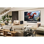 LG 65 inch LG QNED evo AI QNED9M 4K 144Hz Smart TV AI Magic remote webOS25 2025 , A family sits on a couch facing a LG QNED TV mounted on a wall above a LG Soundbar. Zero Connect Box sits inside a coffee table., 65QNED9MA6A, thumbnail 16