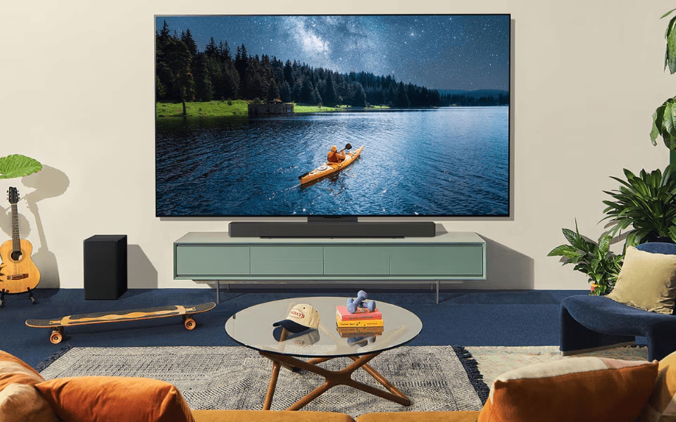LG smart TV showcasing vibrant beach sunset, offering stunning 4K visuals in a stylish modern living room.