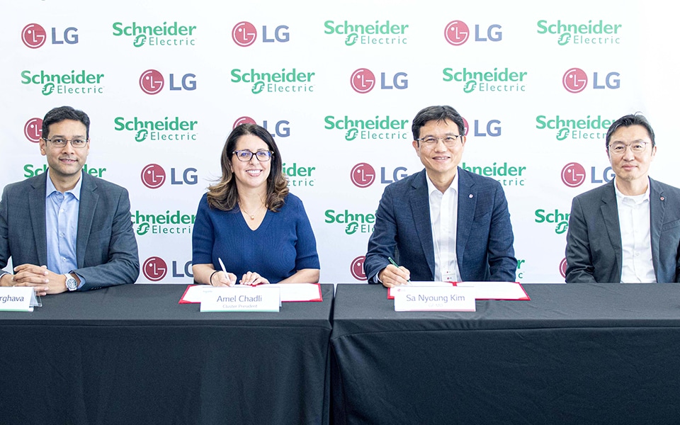 LG and Schneider Electric executives signing the agreement during the official ceremony