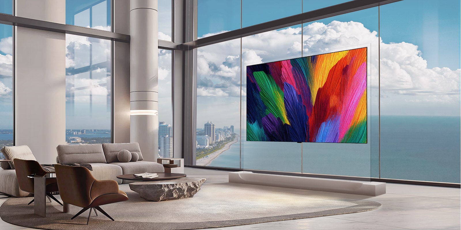 يظهر تلفزيون LG OLED evo AI W6 Wallpaper TV، الذي يبلغ سمك هيكله 9 مم، متكاملًا مع غرفة المعيشة في برج سكني ذي جدران زجاجية، حيث تعزز شاشته التجريدية النابضة بالحياة عمق المساحة مع الحفاظ على جمالية داخلية أنيقة ومتوازنة.