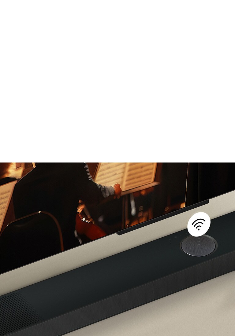 صورة مقربة لتلفزيون LG TV فوق مكبر الصوت LG Soundbar مع رمز WIFI يطفو في الأعلى.
