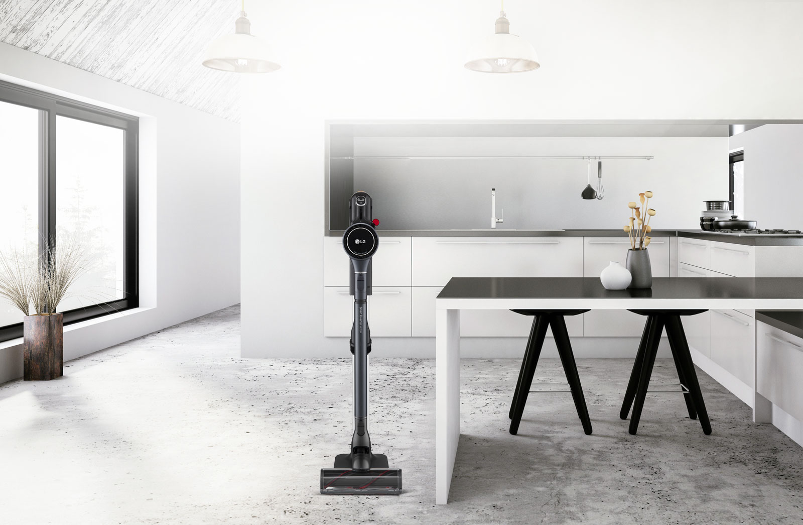 المكنسة الكهربائية CordZero A9 Kompressor في حامل الشحن في مكتب بجوار مكتب.