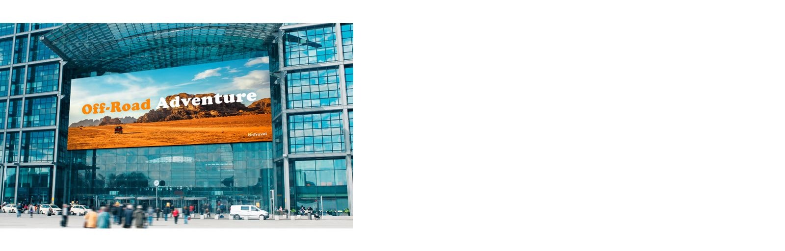 A large GSPA screen is installed on the exterior wall of the building entrance.