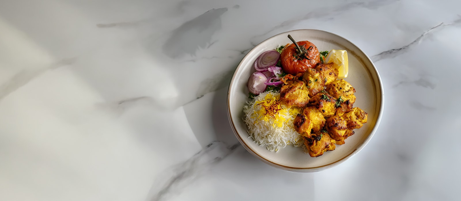AI-generated image of a Jujeh Kabab dish.