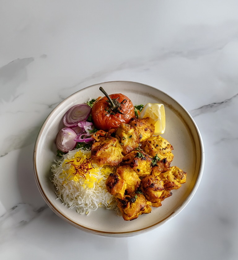AI-generated image of a Jujeh Kabab dish.