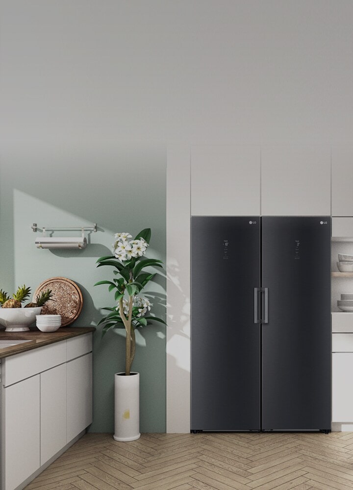 The front view of the refrigerator and freezer or shown fitting in seamlessly in a modern kitchen.
