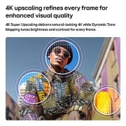 LG تلفزيون LG QNED AI QNED70 Mini LED 4K الذكي مقاس 65 بوصة، إصدار 2026, يُظهر تلفزيون LG QNED AI Mini LED QNED70 مع تقنية 4K Super Upscaling وDynamic Tone Mapping مشهدًا خارجيًا منخفض الزاوية لرجل بين المباني الملونة، حيث يتعرف الذكاء الاصطناعي على المشهد ويرتقي بكل إطار , 65QNED70B6T, thumbnail 6