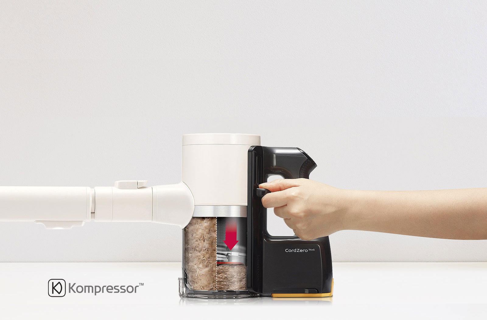 صورة توضح مشهد ضغط الغبار في رأس المكنسة الكهربائية.