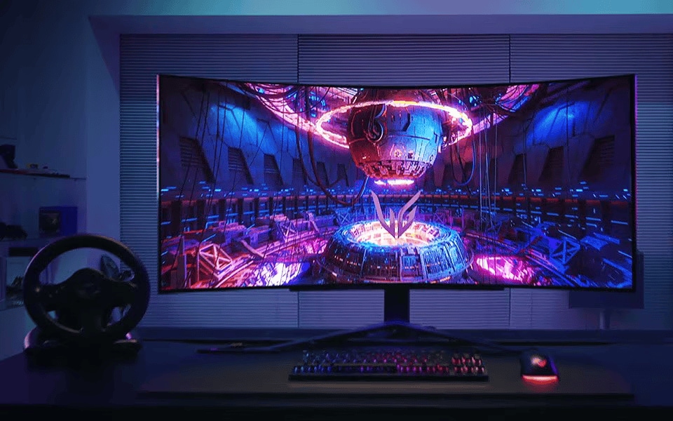 Curved gaming monitor displaying a vibrant sci‑fi scene with neon lights, keyboard and mouse on desk.