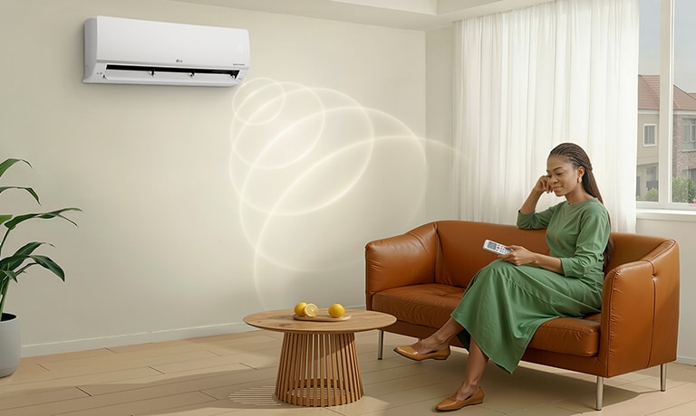A woman relaxing on a sofa using the Mosquito Away mode, which operates independently even without cooling.	
