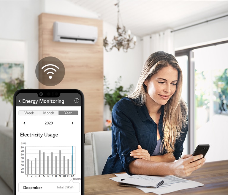 Woman monitoring energy usage with ThinQ™.