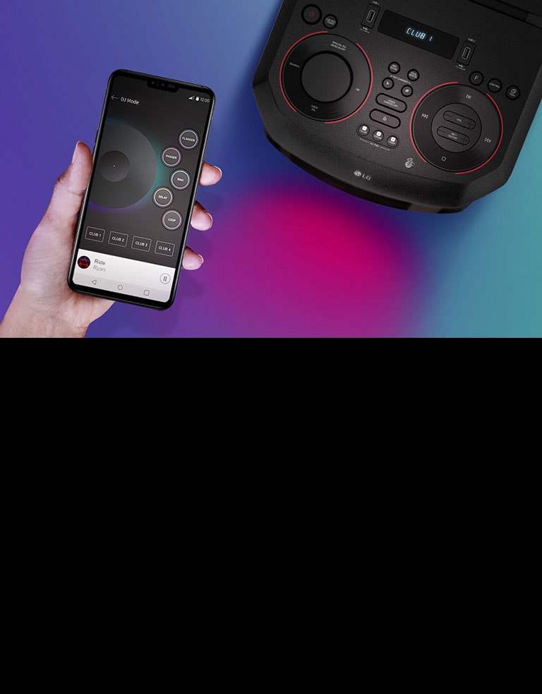 A hand holding a smartphone next to a top view of LG XBOOM.