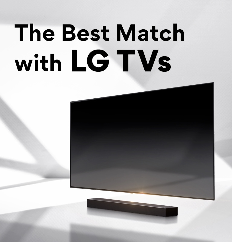 A soundbar and a TV are placed on a white floor and there is a shadow coming from outside right behind.