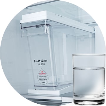 Close-up of LG’s 2007 Non-Plumbing Ice Maker with Pull & Fill water tank and a glass of water placed in front.
