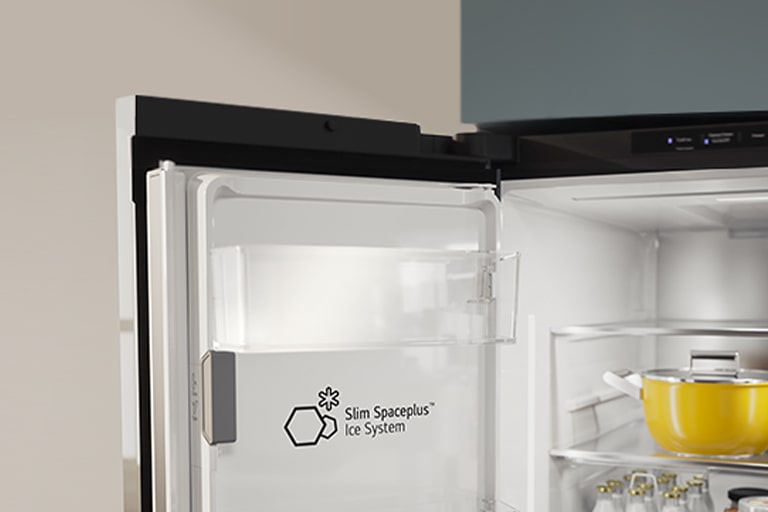 The Slim SpacePlus™ Ice System logo is displayed on the inner door of the open refrigerator.