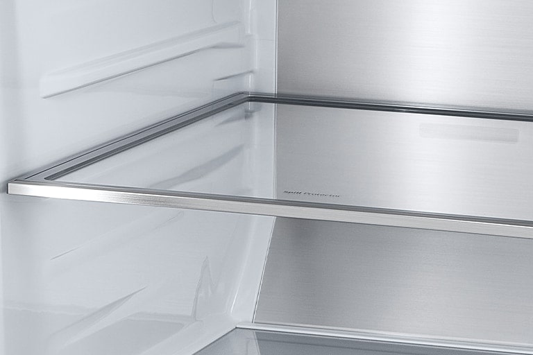 A diagonal view of the shelf with metallic paneling on the interior of the refrigerator.