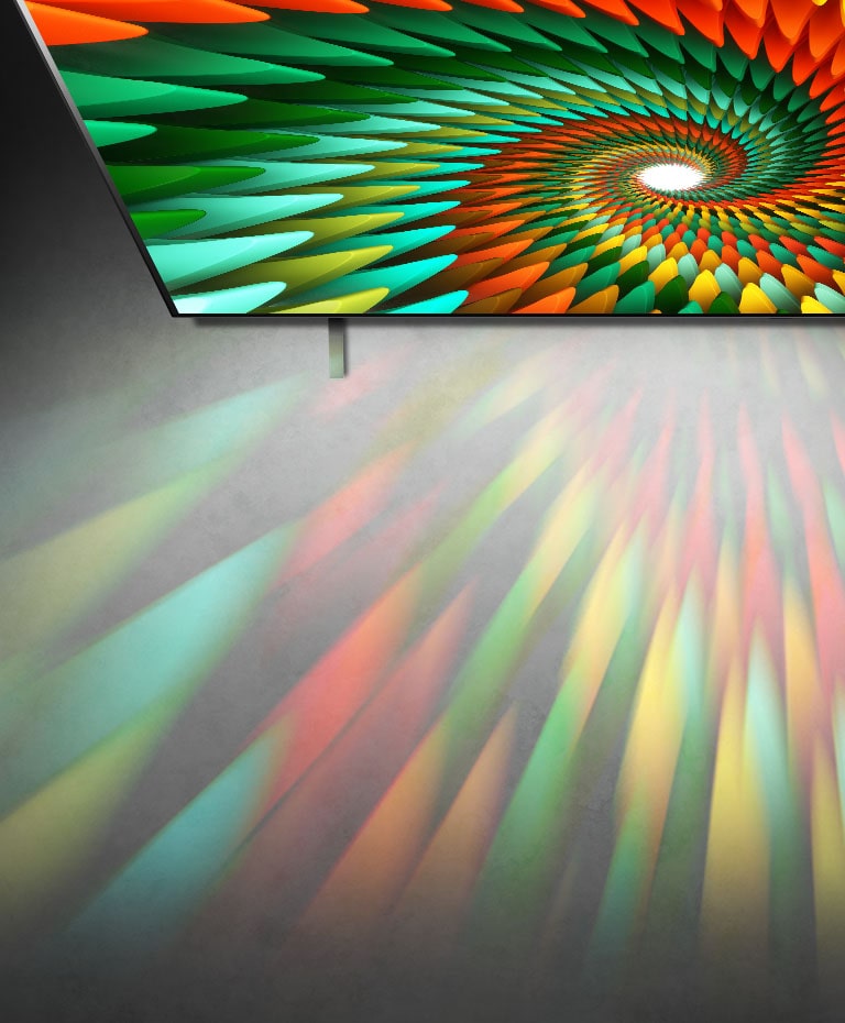 A TV in a stark white room displays colorful spiral shape on the screen.