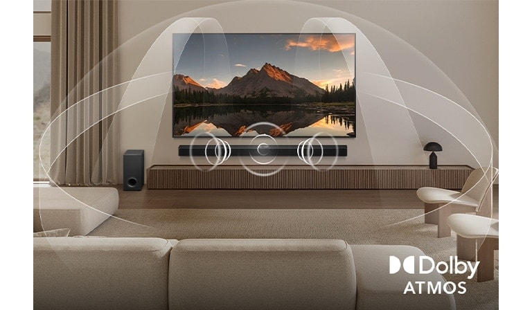 Dimly lit, cozy living room with a couple watching a movie on their LG OLED TV with LG Soundbar. Graphics show how Dolby Atmos fills the whole space with surround sound from all directions. Dolby Atmos logo is at the bottom corner.
