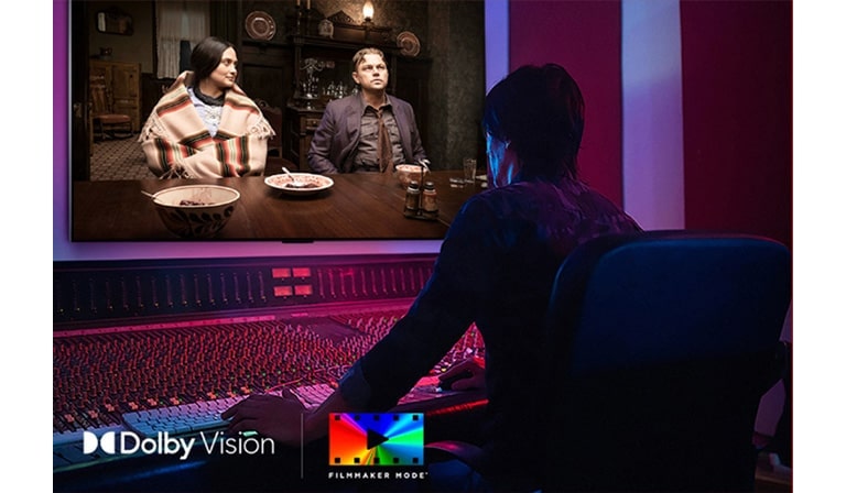 A director in front of a control panel editing the movie "Killers of the Flower Moon" on an LG OLED TV. In the bottom left, the Dolby Vision logo and FILMMAKER MODE logo.