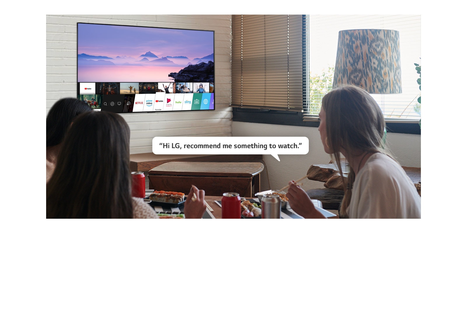 Three woman eating sushi while one of them asks LG TV recommendations to watch