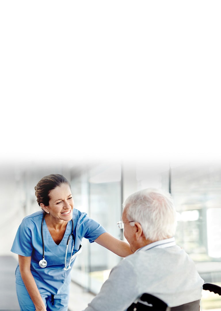 An image of a nurse smiling to a patient.