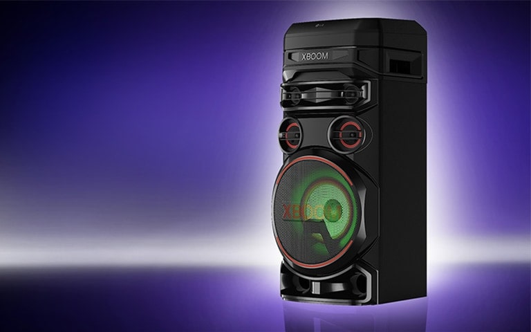 A low angle view of the right side of LG XBOOM against a purple background. The XBOOM lights are red.