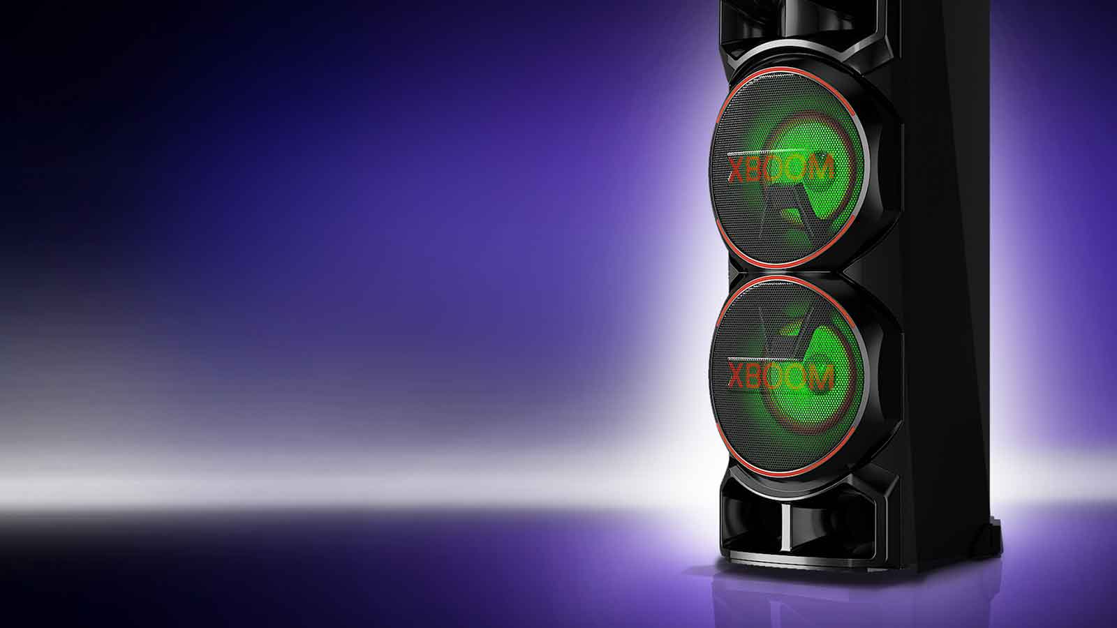 A low angle view of the right side of LG XBOOM against a purple background. The XBOOM lights are red.