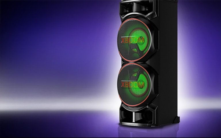 A low angle view of the right side of LG XBOOM against a purple background.  The XBOOM lights are red.