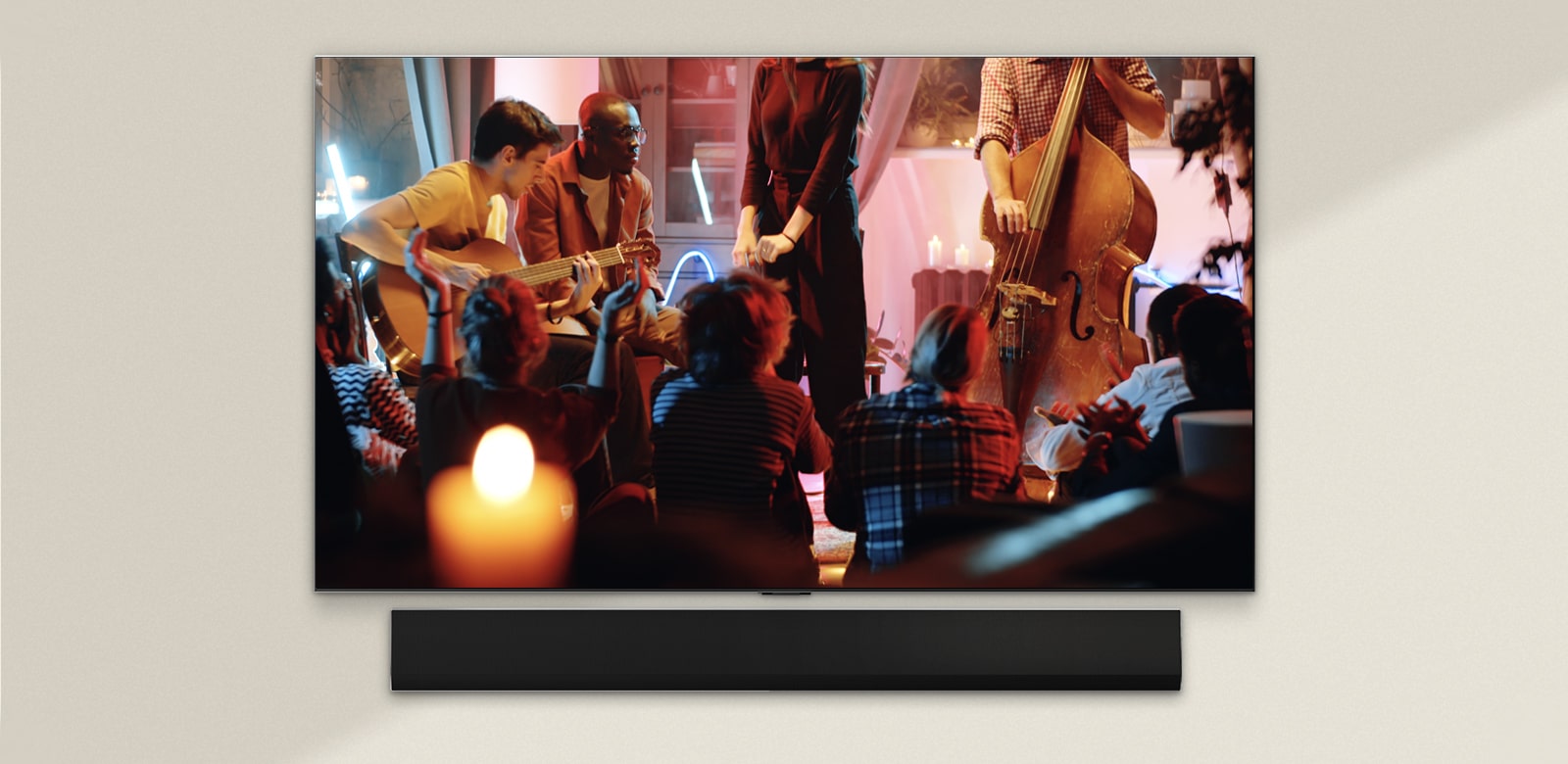 A cozy concert in a living room is playing on the screen. The WOW Interface menu appears as an overlay and the user navigates to soundbar settings.