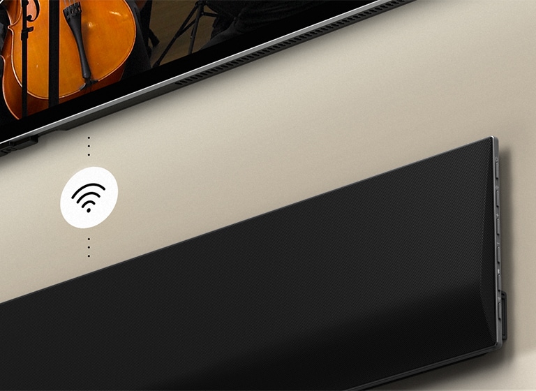 A close up of an LG Soundbar below a LG TV. A connectivity symbol is in between LG Soundbar and a LG TV, showing WOWCAST's wireless operation.