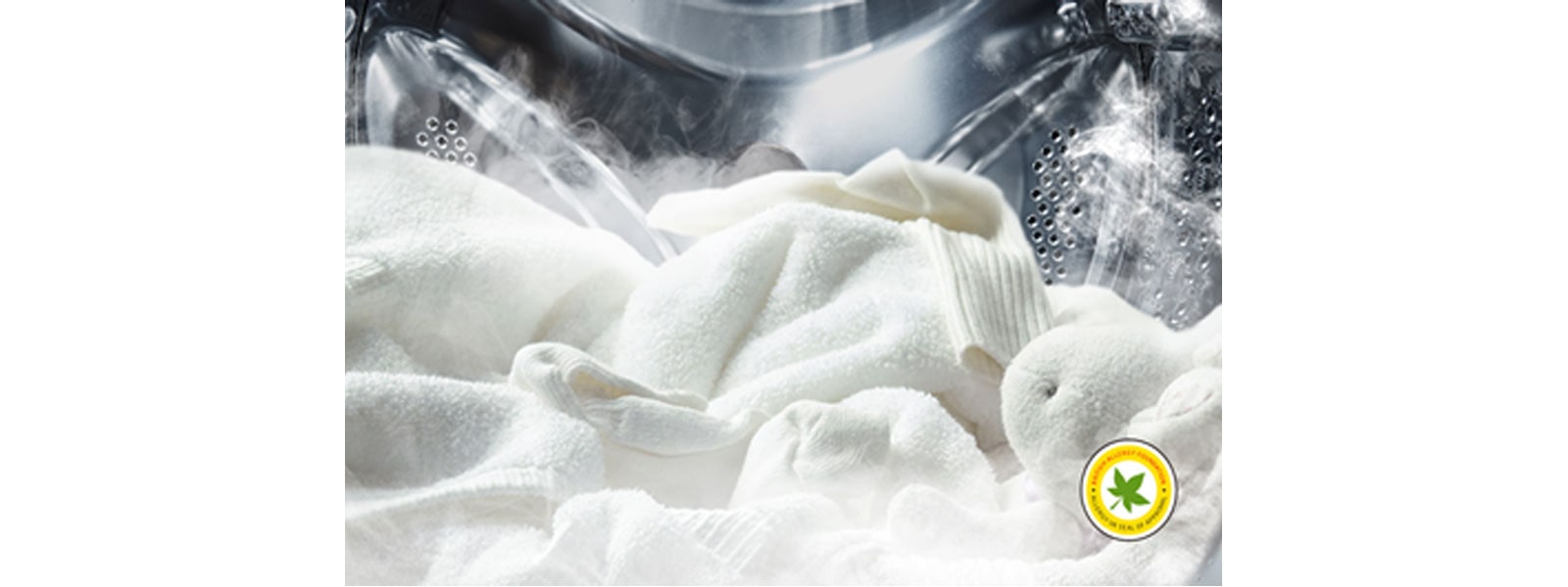 LG washing machine drum filled with white laundry and steam rising out the clothes from LG’s Steam™ technology approved by The British Allergy Foundation 
