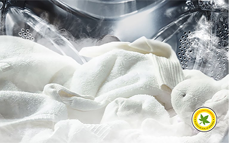 LG washing machine drum filled with white laundry and steam rising out the clothes from LG’s Steam™ technology approved by The British Allergy Foundation 