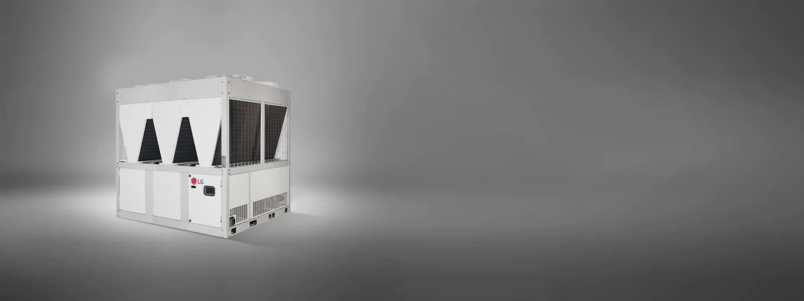On display is an LG Air-cooled Inverter Scroll Heat Pump, characterized by a rectangular base and a triangular top structure, rendered in a white.