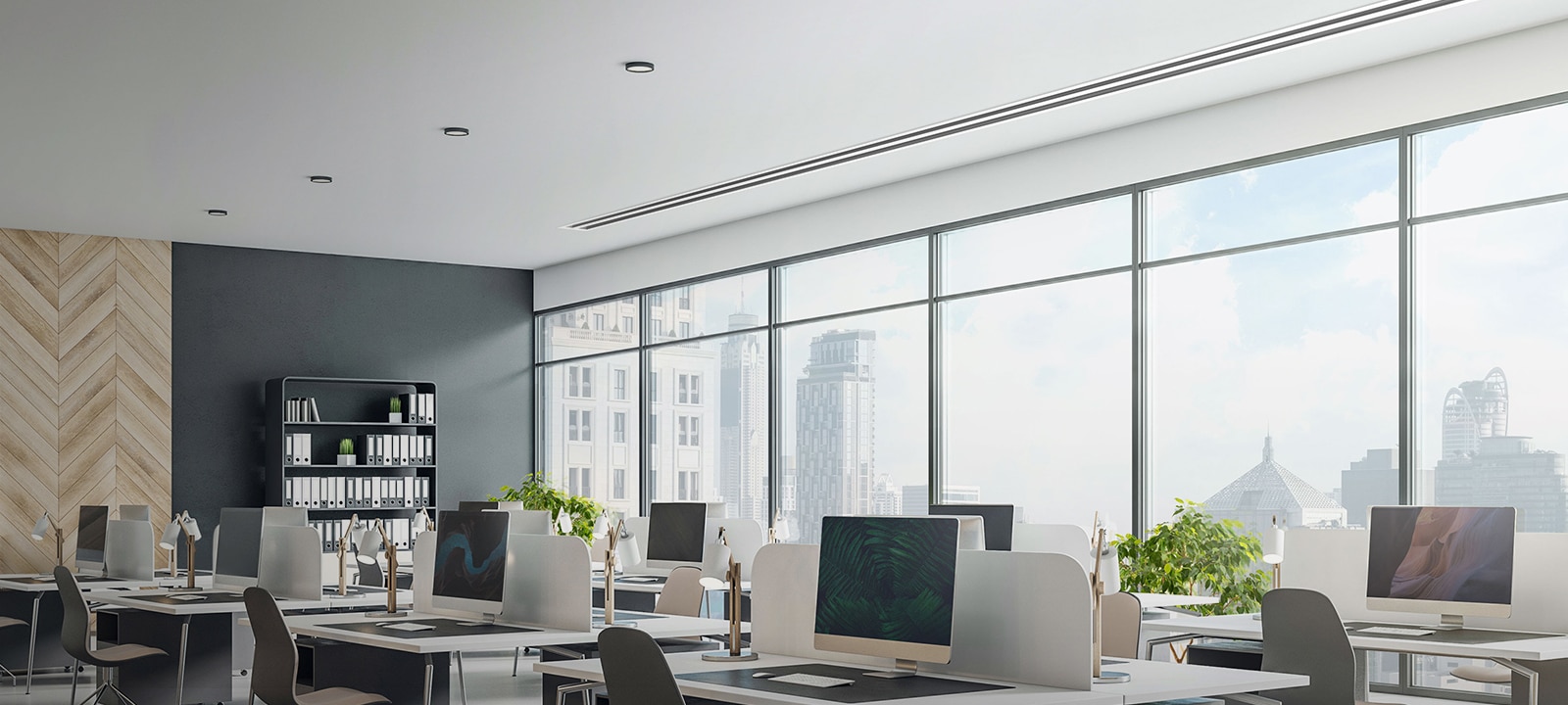 Office with skyline view features desks and LG Concealed Duct AC maintaining a sleek interior look.