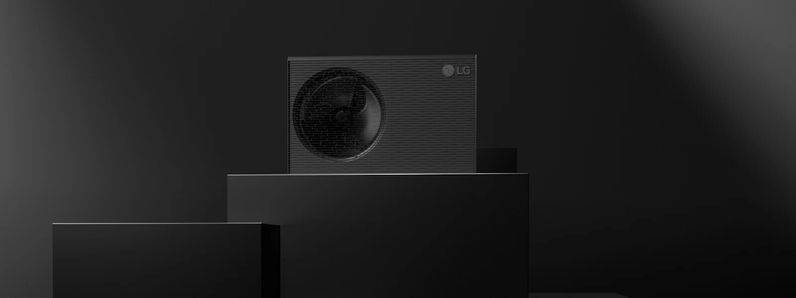 A full shot and close-up of the R290 Monobloc with the running fan mounted on the left side. Its refined grey fits seamlessly with a building's exterior.  