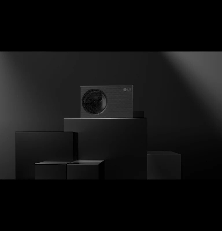 A full shot and close-up of the R290 Monobloc with the running fan mounted on the left side. Its refined grey fits seamlessly with a building's exterior.  