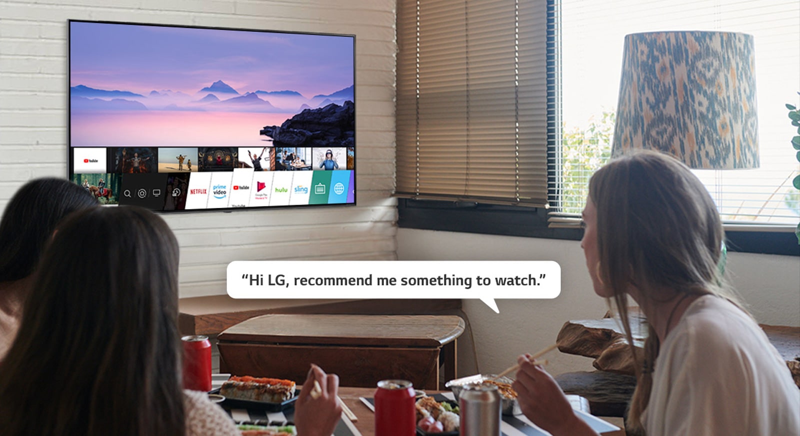 Three woman eating sushi while one of them asks LG TV recommendations to watch.